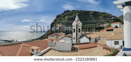 View of Ponta do Sol, a small touristic village in the city of Funchal, main avenue facing the sea, with residential buildings, Madeira Island, Portugal