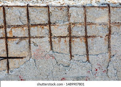 View of the poor concrete cover and corrosion of reinforcement bars. Concrete can be damaged by physical damage and chemical damage (from carbonatation, chlorides, sulfates and non-distilled water).
