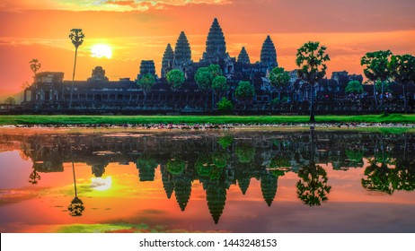 “Sunrise view of popular tourist attraction ancient temple complex Angkor Wat with reflected in lake Siem Reap, Cambodia.