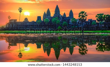 “Sunrise view of popular tourist attraction ancient temple complex Angkor Wat with reflected in lake Siem Reap, Cambodia.
