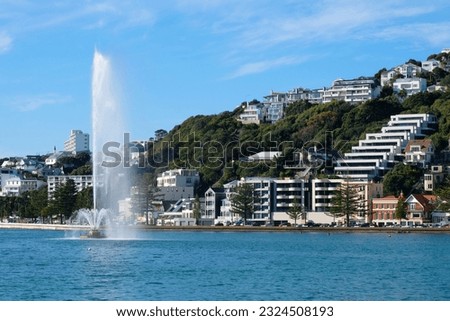View of popular waterfront Oriental Parade, harbour and water fountain in capital city of Wellington, New Zealand Aotearoa