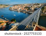 View of Porto city and Douro river and Dom Luis bridge I from famous tourist viewpoint Miradouro da Serra do Pilar on sunset. Porto, Vila Nova de Gaia, Portugal