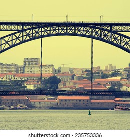 view of Porto, Portugal with the famous Dom Luis bridge over the river Douro, instagram effect, toned square image