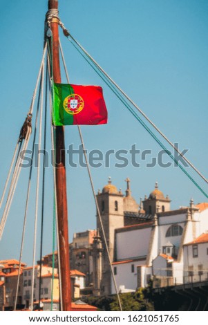 Similar – Image, Stock Photo Portuguese flag on boat in front of old town of Porto / Portugal