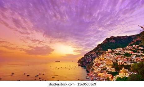 View Of Positano Village Along Amalfi Coast In Italy At Sunset.