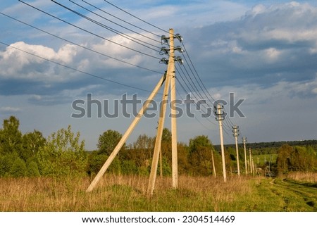 View of power line in picturesque countryside
