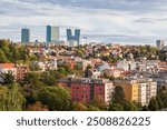 view of Prague in autumn, new glass high-rise buildings and old buildings with red roofs, 
architecture in Prague, Czech Republic