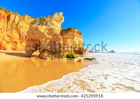 Similar – Image, Stock Photo Sunset reflections at Praia Emilia’s rocky beach