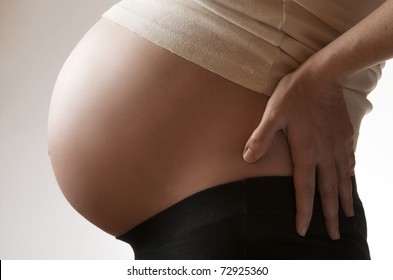 View Of  A Pregnant Woman With Back Pain