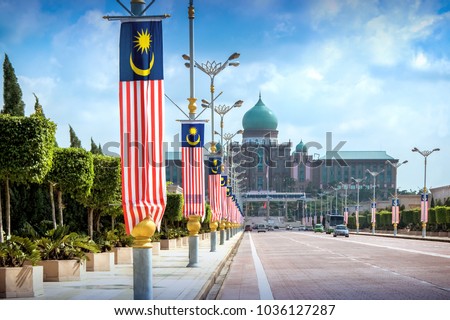 View of the Prime Minister's office from the Seri Gemilang Bridge in the planned city of Putrajaya south of Kuala Lumpur with malaysian flags all along the road