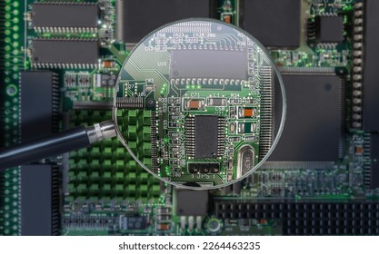 view of printed circuit board with active and passive surface mounted components close up through magnifying glass