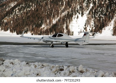 A view of propeller planes taking off in the snowy mountains in the alps switzerland