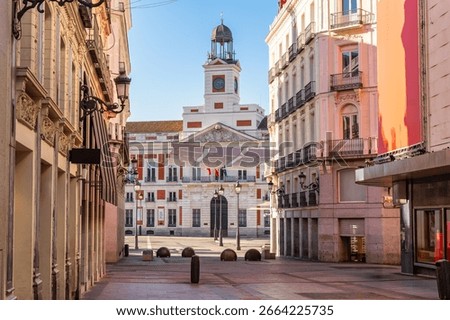 View of the Puerta del Sol clock tower from Callao Street in central Madrid, Spain