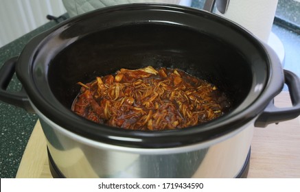 View Of Pulled Chicken Cooked In A Crock Pot.