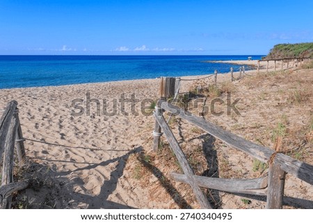 View of Punta Prosciutto beach from footpath through dunes sea, an seaside near town of Porto Cesareo in Apulia, southern region of Italy.
