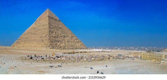 View with the Pyramid of Cheops, the biggest from the site of the great pyramids of the Giza Necropolis. Al Haram, Giza Governorate, Egypt, Africa. Cairo city in background.