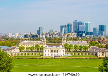 View of Queens House and Canary Wharf from Greenwich Park in London, England, UK