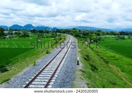 View of railway tracks in rural Indonesia in the afternoon