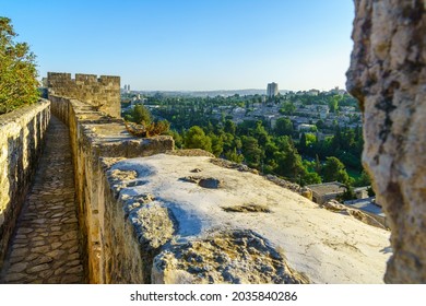 View Of The Ramparts Walk, Over The Old City Walls, And The Yemin Moshe Neighborhood In The New City, With Its Windmill, In Jerusalem, Israel