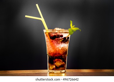 View Of A Rasberry Mojito Cocktail In Black Font.