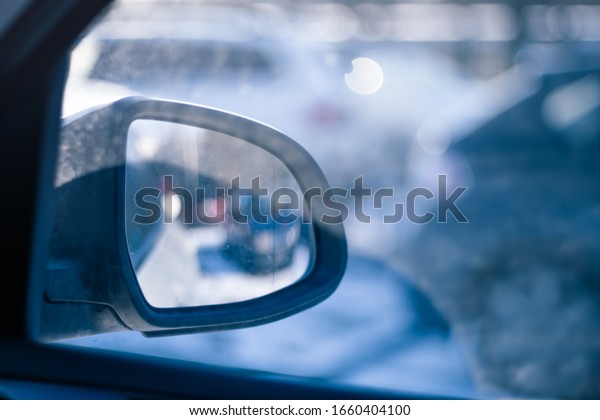 View\
in the rear view mirror from the inside of the\
car.
