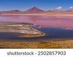 View of red lagoon and mountain range , Colorada Lake in Salar de Uyuni district, Bolivia.