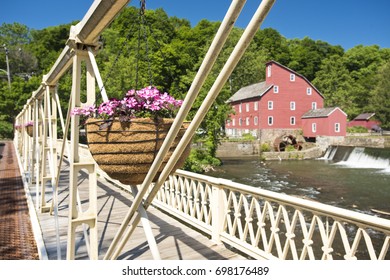 A view of the Red Mill through the Main St. Bridge in Clinton, New Jersey on a summer day.