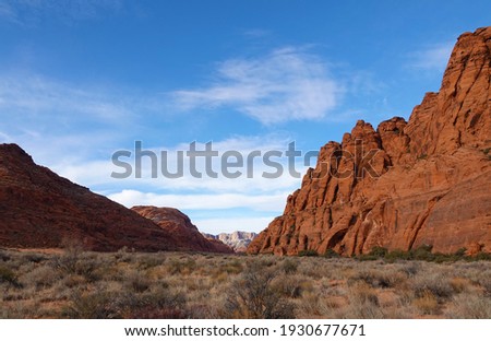 View of red rocks and the landscape of Snow Canyon State Park, Utah, from Jenny's Canyon trail.