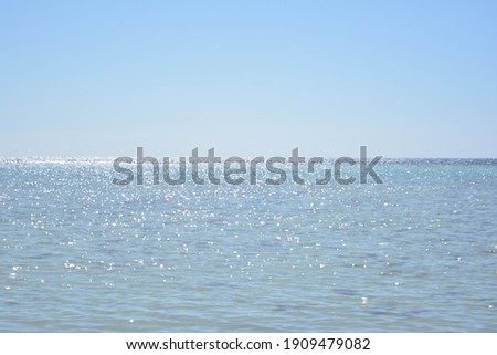 A view of the Red Sea on the shores of the city of Yanbu, Saudi Arabia at noon, and weibo shining sunlight