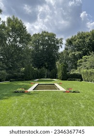 View of the reflection pool in the formal garden at the Edsel and Eleanor Ford House and estate in Grosse Pointe Shores, Michigan.