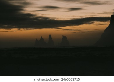 View of Renisfjara from Vik, black beach, rocks, basalt, sunset, sea view - Powered by Shutterstock