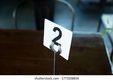 A View Of A Restaurant Number Holder On A Table.