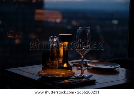 View from a restaurant on a skyscraper with panoramic windows in the evening