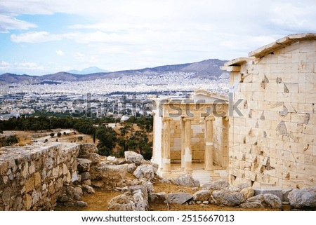View of the restored Ionic style Temple of Athena Nike, winged goddes of victory on the hill of the Acropolis in Athens, Greece. Sightseeing and vacation in Greece