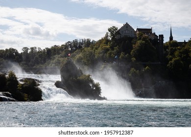 View of Rheinfall waterfall in Rheinhausen - Neuhausen during a summer day with turquoise water (Schaffhausen, Switzerland, Europe)