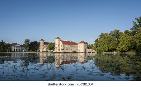 View of Rheinsberg Palace and its reflection on the lake.