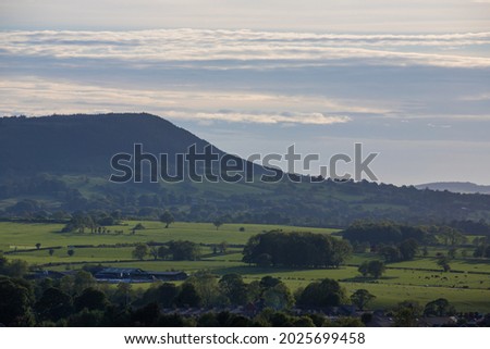View of the Ribble Valley from the top of Clitheroe castle. Longridge fell in summer with a green landscape