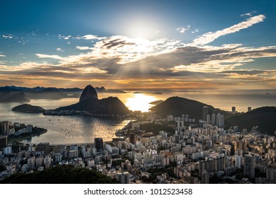 View Of Rio De Janeiro City Landmark - The Sugarloaf Mountain, With The Sun Shining Above