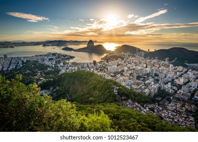 View Of Rio De Janeiro City Landmark - The Sugarloaf Mountain, With The Sun Shining Above