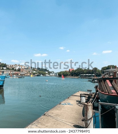 View of the river Avon in Bristol on a brigth hot summer day with clear blue sky and river boats surrounding