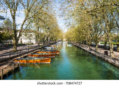 View of river and boat from bridge of love, Annecy France