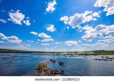 View Of The Iguaçu River, Border Between Brazil And Argentina, Above The Iguaçu Falls. The Falls Are One Of The Seven Wonders Of The World And Are Located In The Iguaçu National Park.