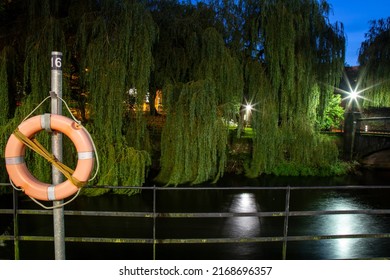 View of River Lee close to Fitzgerald Park in the evening in Cork City, Ireland. Orange lifebuoy attached to the railings