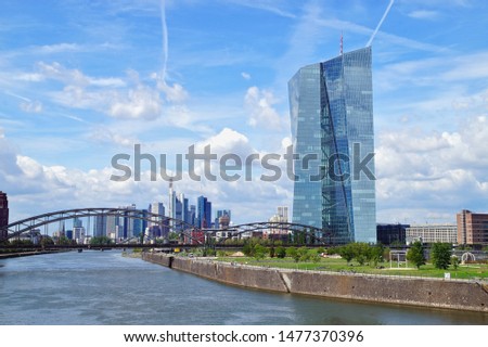 view of the river Main and ECB with the european city skyline ,financial centre of Frankfurt. Skyscraper buildings in Germany on blue sky background. Business and finance concept