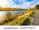 View from the Riverfront Trail walking path along the Clark Fork River at Caras Park of the University District in downtown Missoula, Montana.