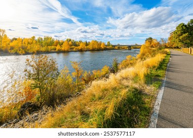 View from the Riverfront Trail walking path along the Clark Fork River at Caras Park of the University District in downtown Missoula, Montana.