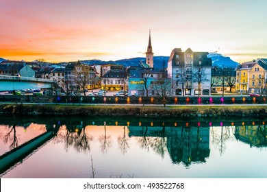 view of a riverside of river Drau during sunset in Villach, Austria