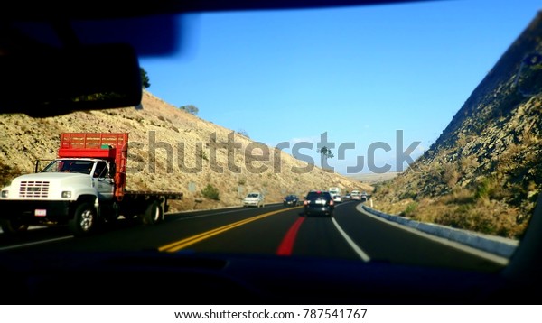 View of the road from inside the car, Behind\
windshield, vintage color