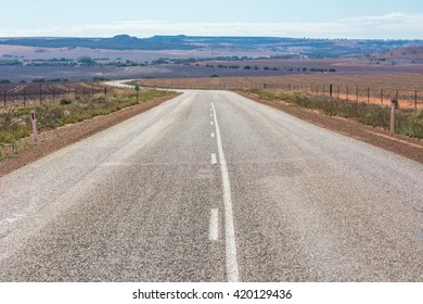 View Of Road Leading Into The Distance Outback At Western Australia