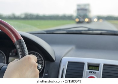 View Of The Road And Oncoming Traffic From A Moving Car